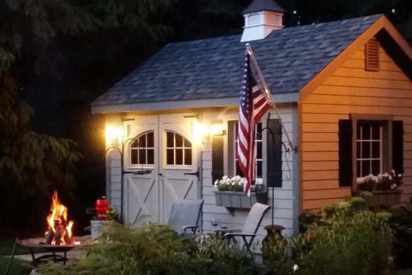 Garden shed with bonfire at night