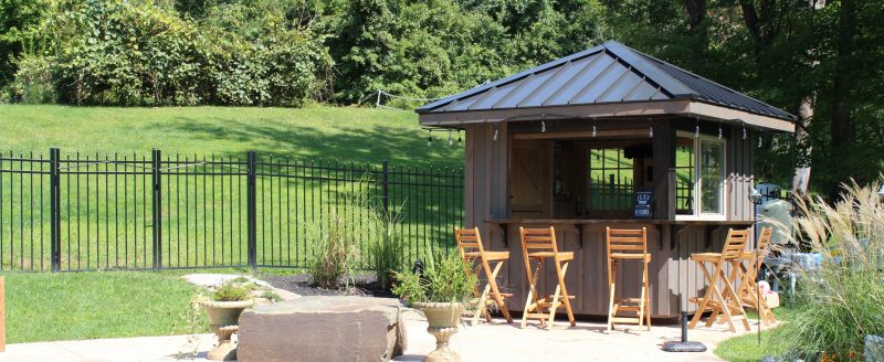 pool house by steel fence